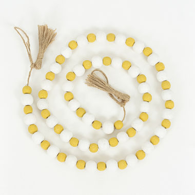 Click here to see Adams&Co 50399 50399 49x.5 wooden garland with tassels, multicolor The Adams Family Collection