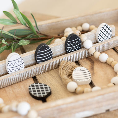 Click here to see Adams&Co 30263 30263 2x2x.25 wood shapes set of six (EGGS) black, white Love In Bloom Collection