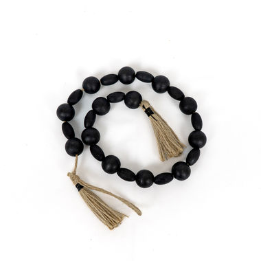 Click here to see Adams&Co 50428 50428 25x1x1 wood bead garland w/ tassels, black, brown The Adams Family Collection
