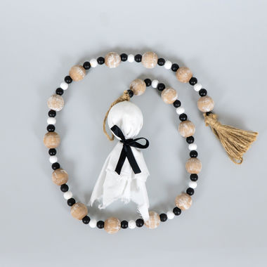 Click here to see Adams&Co 55277 55277 35x6x2 wood bead garland with tassels (GHOST) multicolor Haunted Mansion Collection