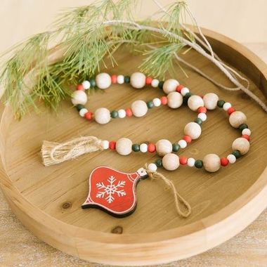 Click here to see Adams&Co 75538 75538 35x4x1 wood bead garland w/ tassels (ORNAMENT) multicolor Mid Century Collection