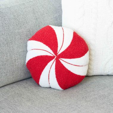 Click here to see Adams&Co 71292 71292 12x12x4 reversible pillow (PEPPERMINT) red, white Candy Cane Lane Collection