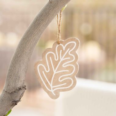 Click here to see Adams&Co 50485 50485 4x5x.25 wood ornament (LEAF) natural, white Adams Family Collection